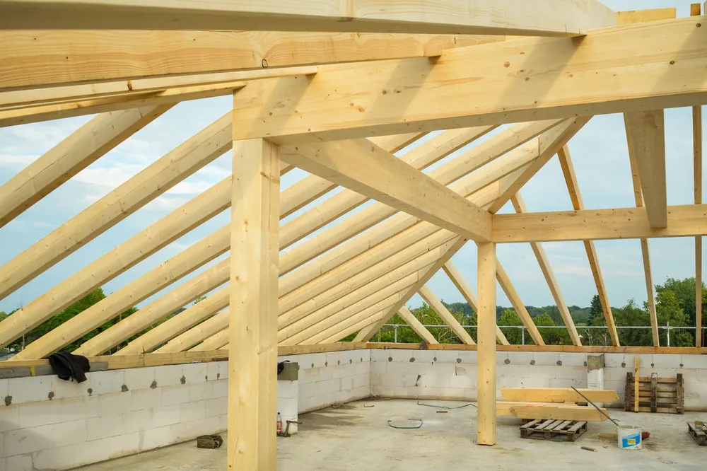 Timber roof trusses set over block walls